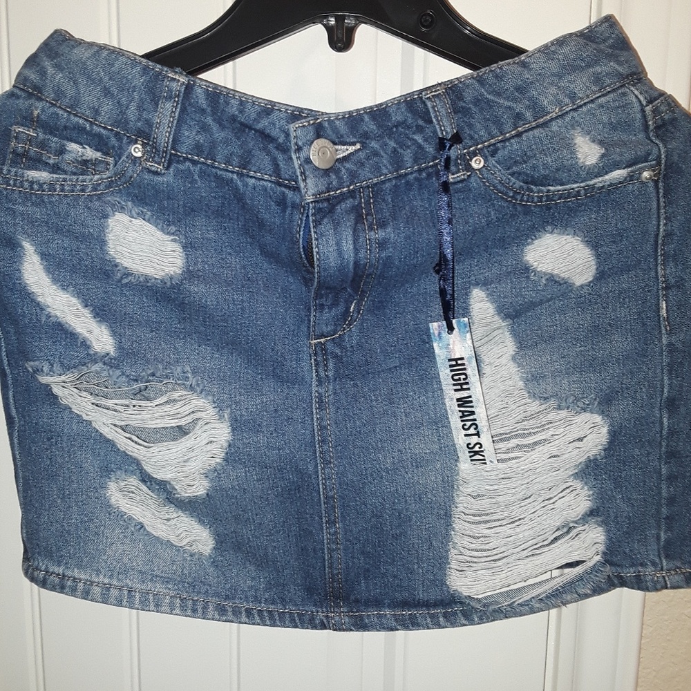 girl blue Jean distressed mini skirt